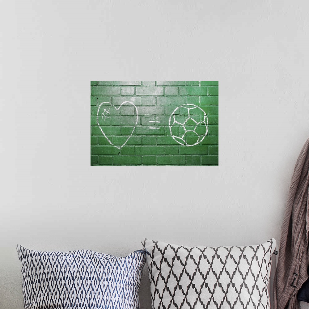 A bohemian room featuring Love = Football drawn in chalk on wall.