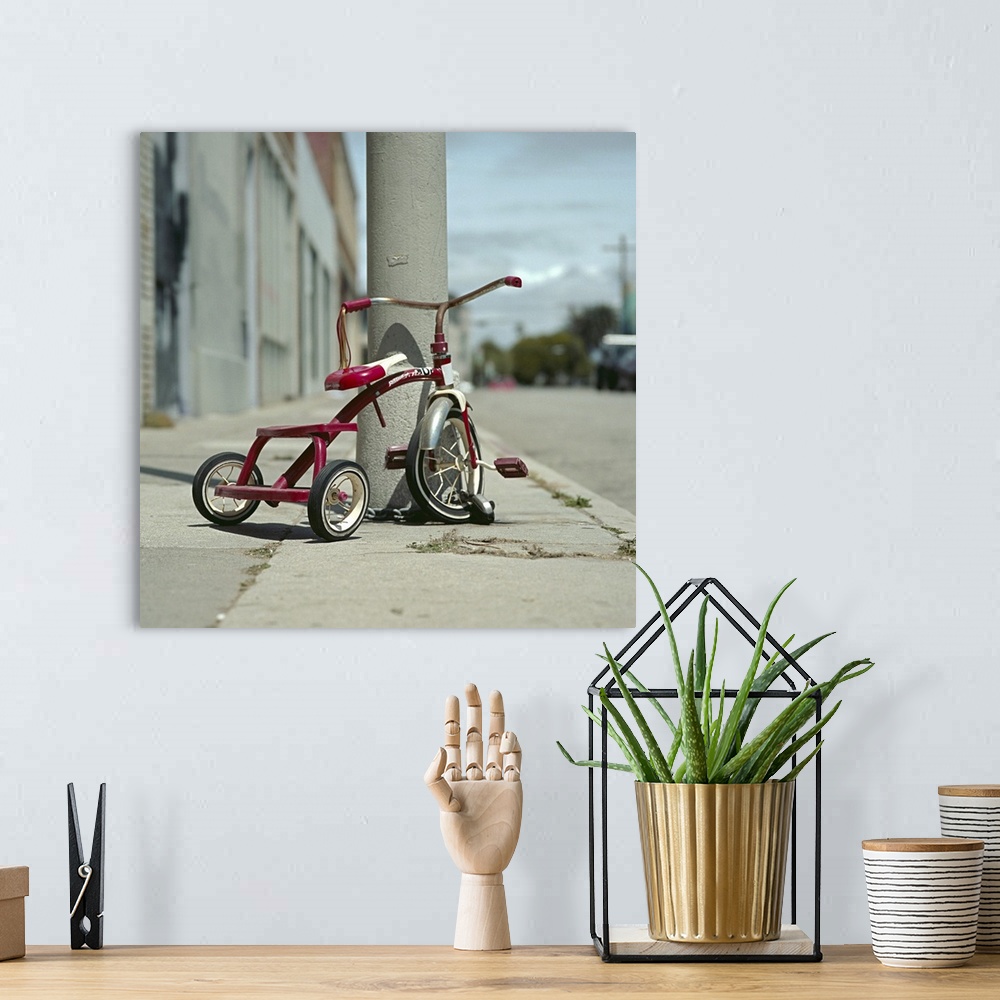 A bohemian room featuring Lovely red tricycle