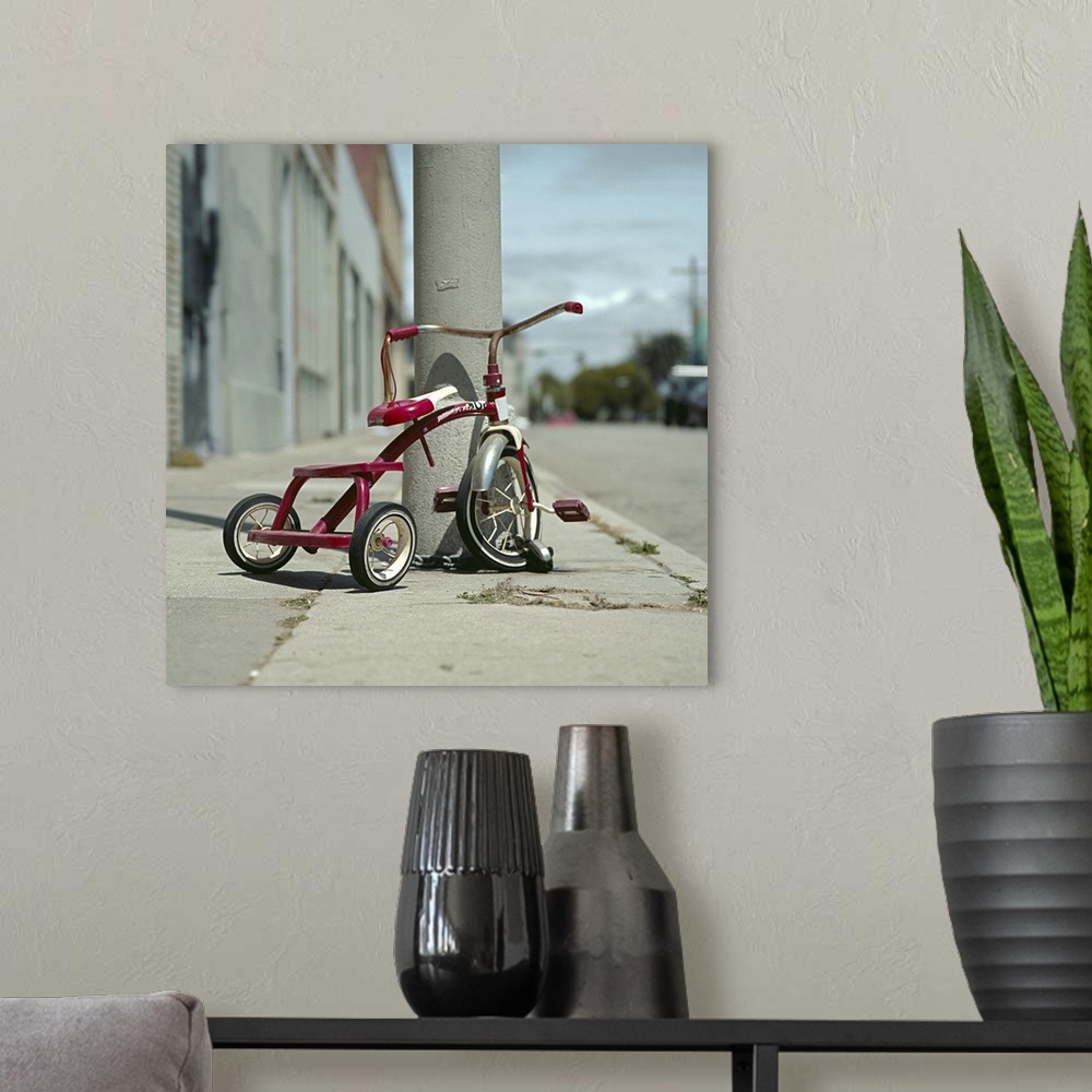 A modern room featuring Lovely red tricycle
