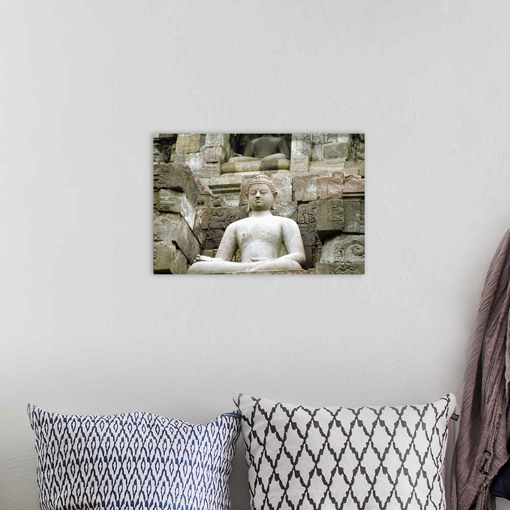 A bohemian room featuring Low angle view of the Statue of Buddha, Borobudur Temle, Java, Indonesia