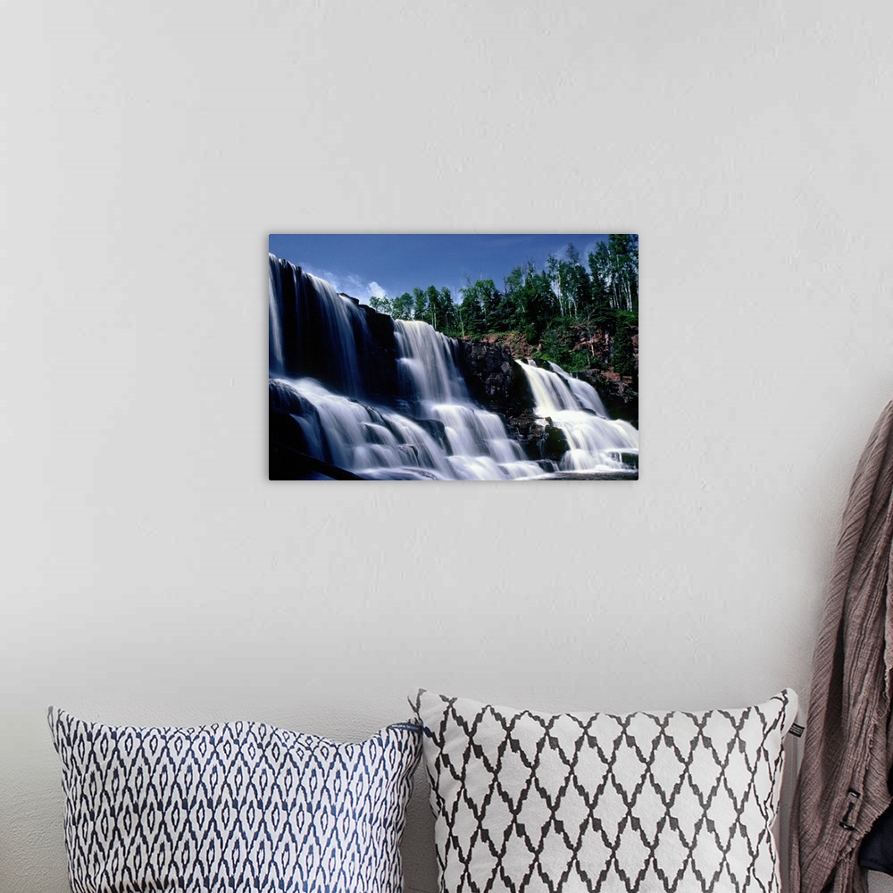 A bohemian room featuring Low angle view of three waterfalls