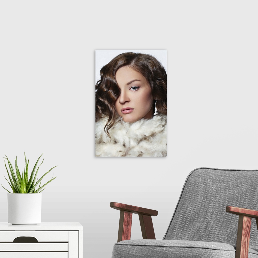 A modern room featuring Fashionable portrait of beautiful young woman wearing fur, professional make-up and hairstyle