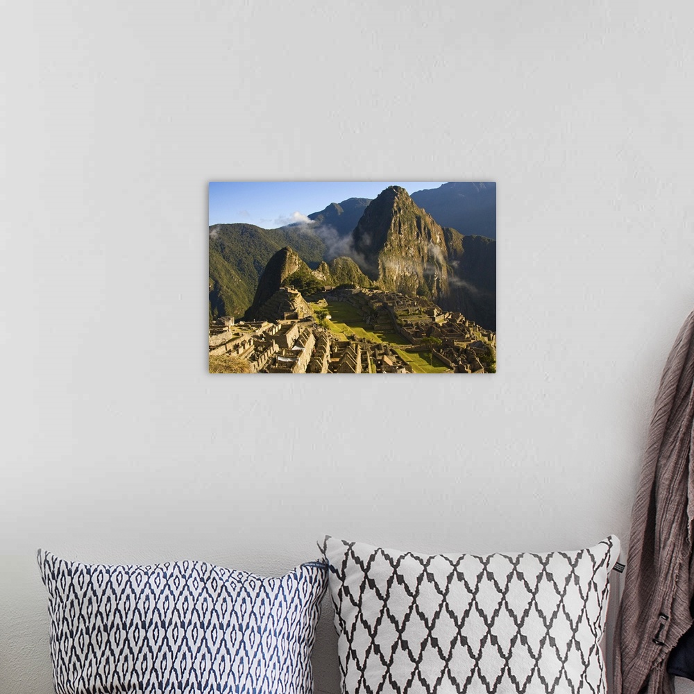 A bohemian room featuring Machu Picchu as the last of the morning fog burns off the lost Inca city