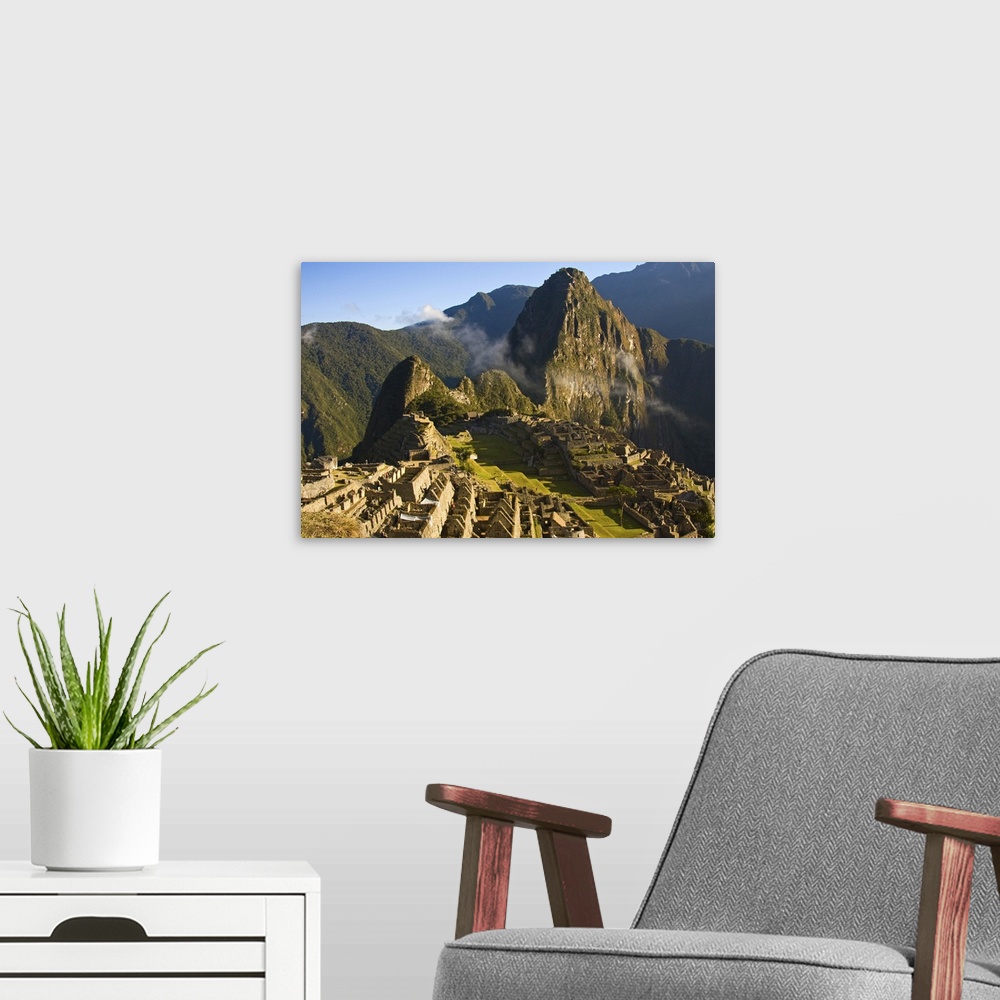 A modern room featuring Machu Picchu as the last of the morning fog burns off the lost Inca city
