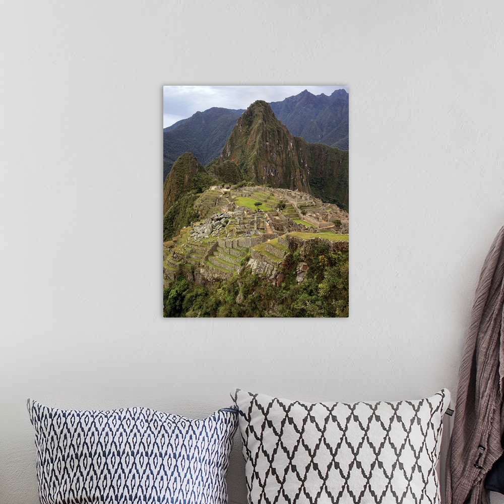 A bohemian room featuring Machu Picchu, Peru on gray, cloudy morning.