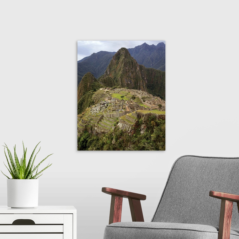 A modern room featuring Machu Picchu, Peru on gray, cloudy morning.