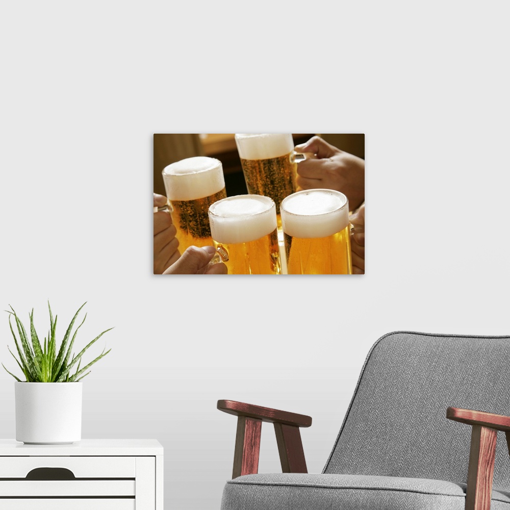 A modern room featuring Making a toast with beer