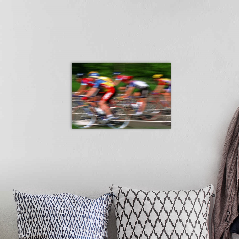 A bohemian room featuring Male cyclist riding bicycle (blurred motion)