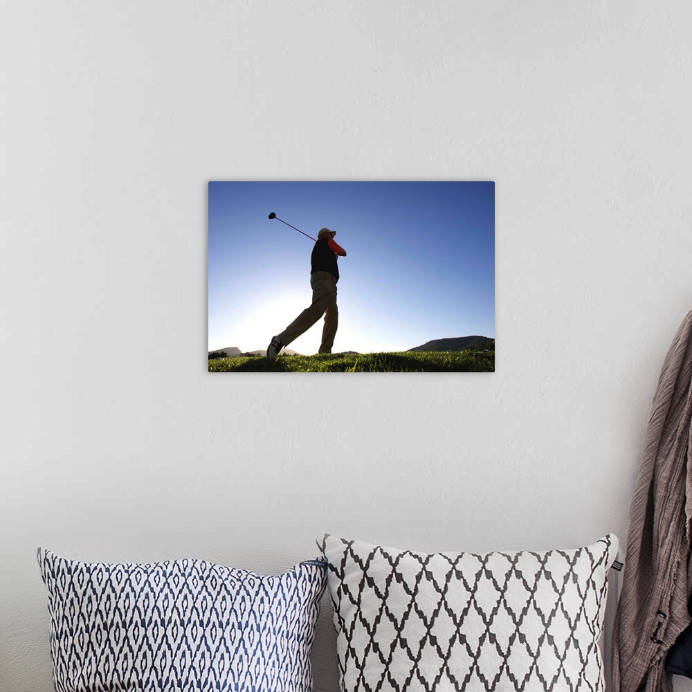 A bohemian room featuring Male golfer, low angle view