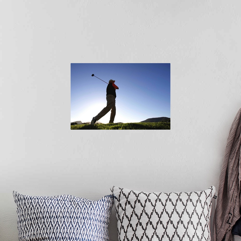 A bohemian room featuring Male golfer, low angle view