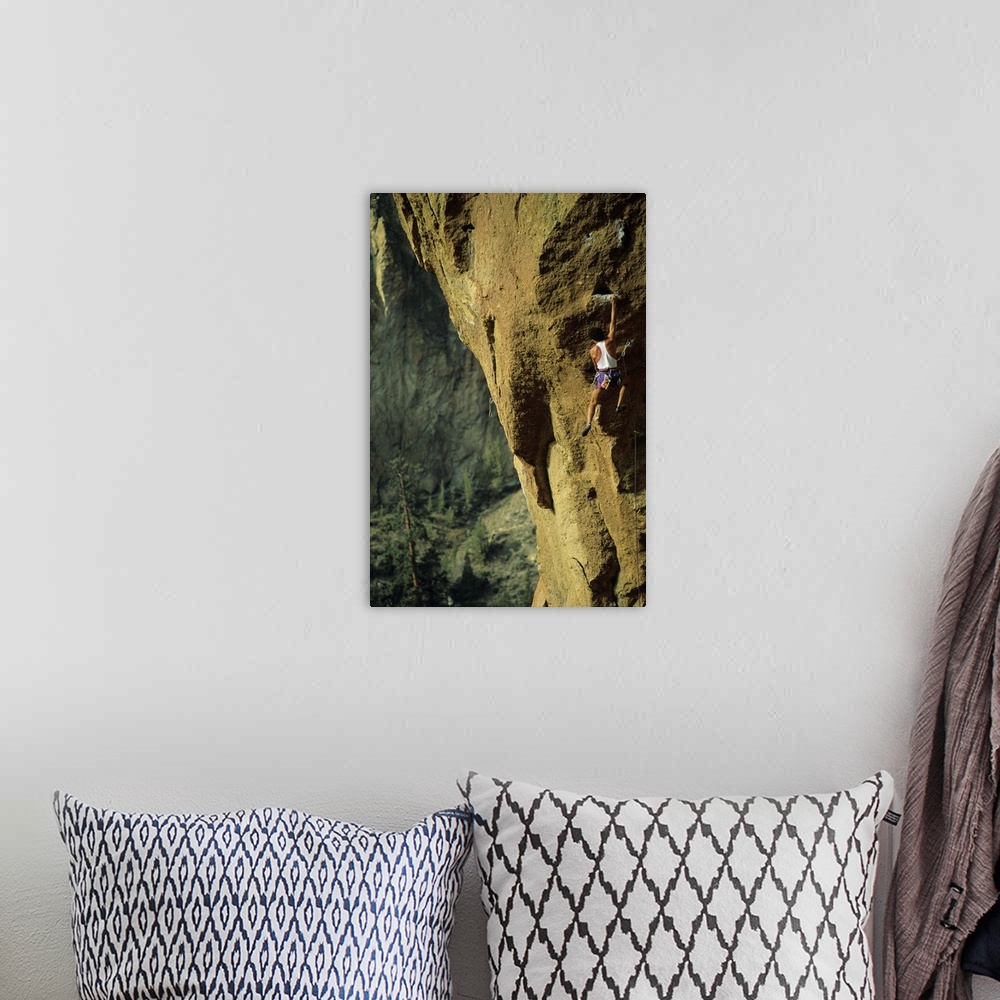 A bohemian room featuring Male rock climber scaling rock face in Smith Rock, Oregon, USA,
