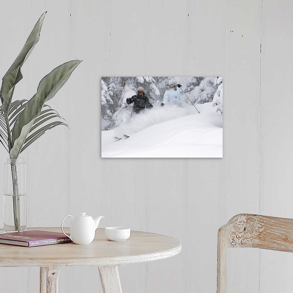 A farmhouse room featuring Man and woman snow skiing