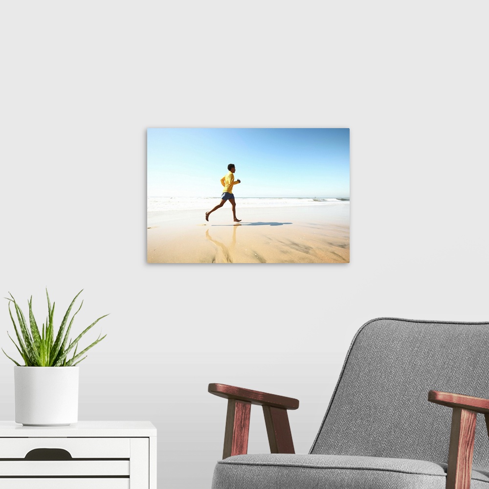 A modern room featuring Man jogging on beach