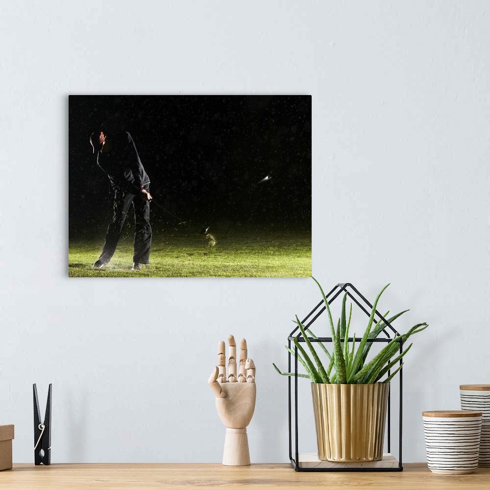A bohemian room featuring Man playing golf, hitting ball