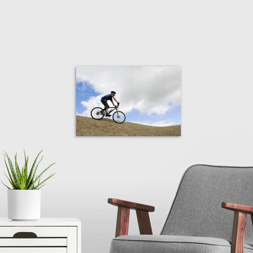A modern room featuring Man riding mountain bike