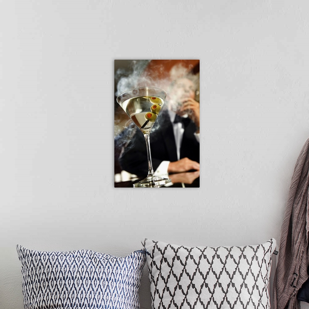 A bohemian room featuring Man smoking cigar with martini on bar