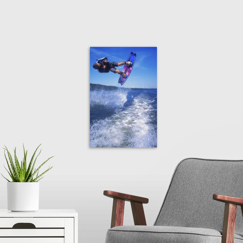 A modern room featuring Man wakeboarding on Coal Lake Alberta Canada