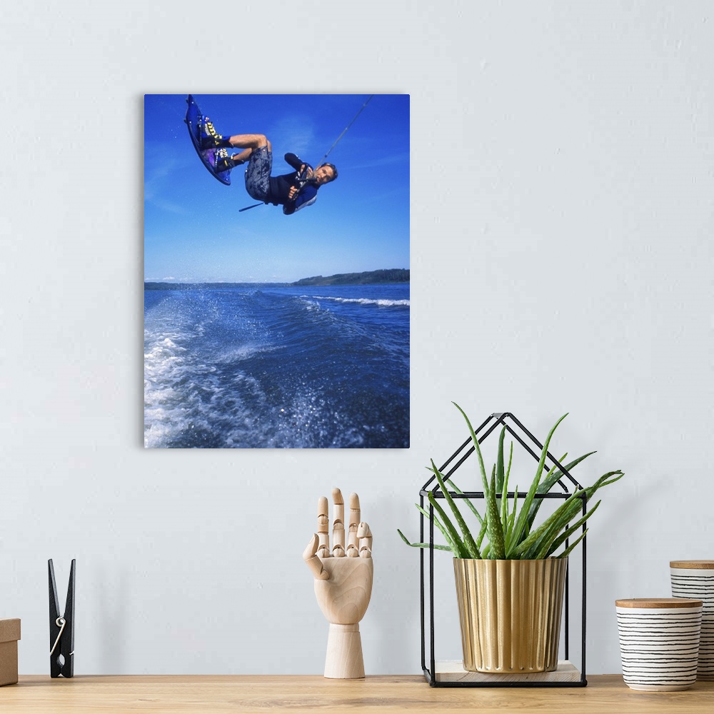 A bohemian room featuring Man wakeboarding on Coal Lake Alberta Canada