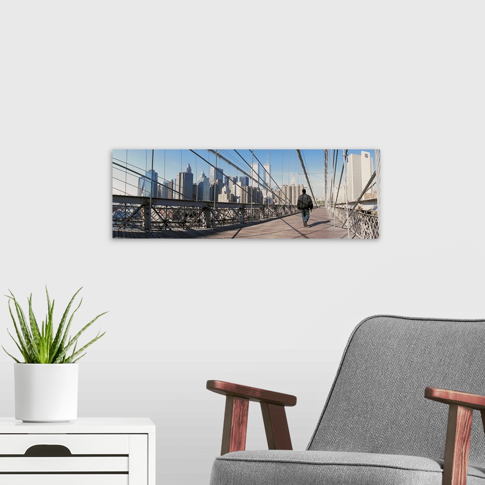 A modern room featuring Man walking on Brooklyn Bridge