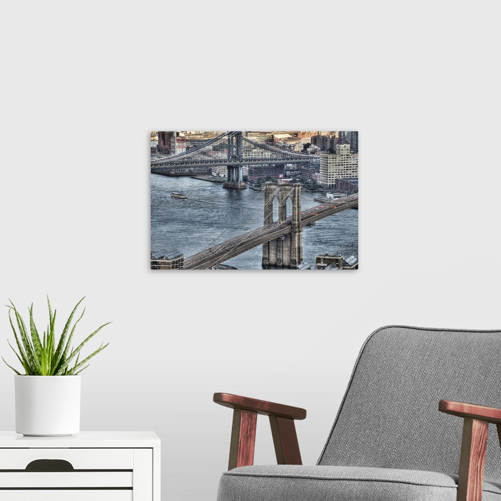 A modern room featuring Brooklyn and Manhattan Bridges and DUMBO area in Brooklyn.