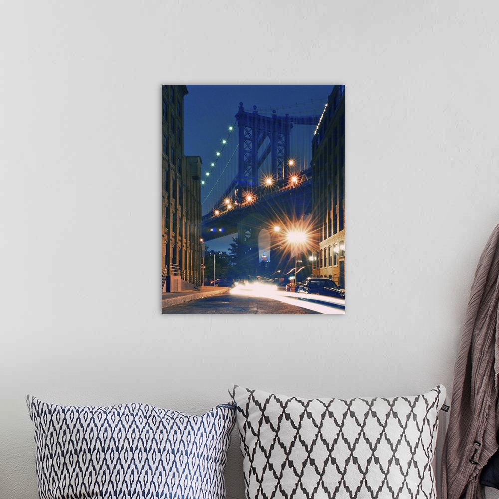 A bohemian room featuring Manhattan Bridge and Empire State Building at night.