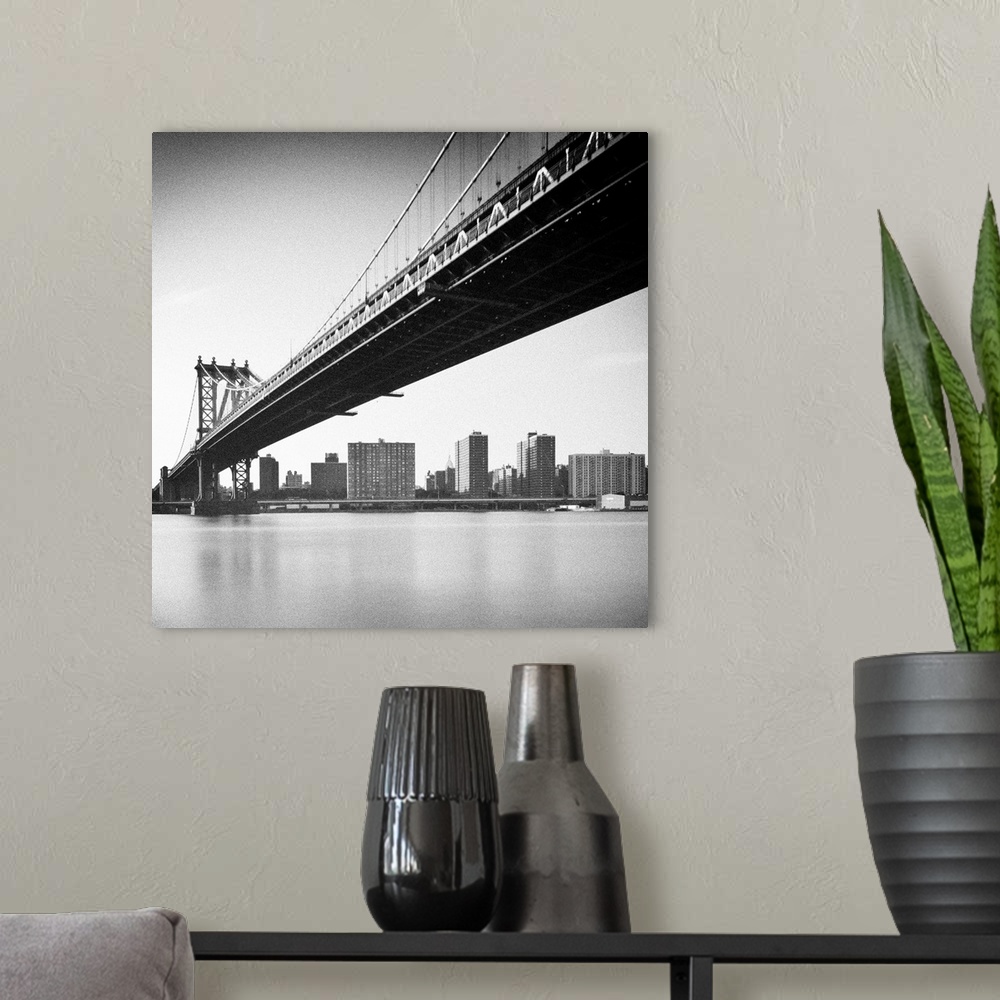 A modern room featuring Manhattan Bridge and skyline, New York, US.