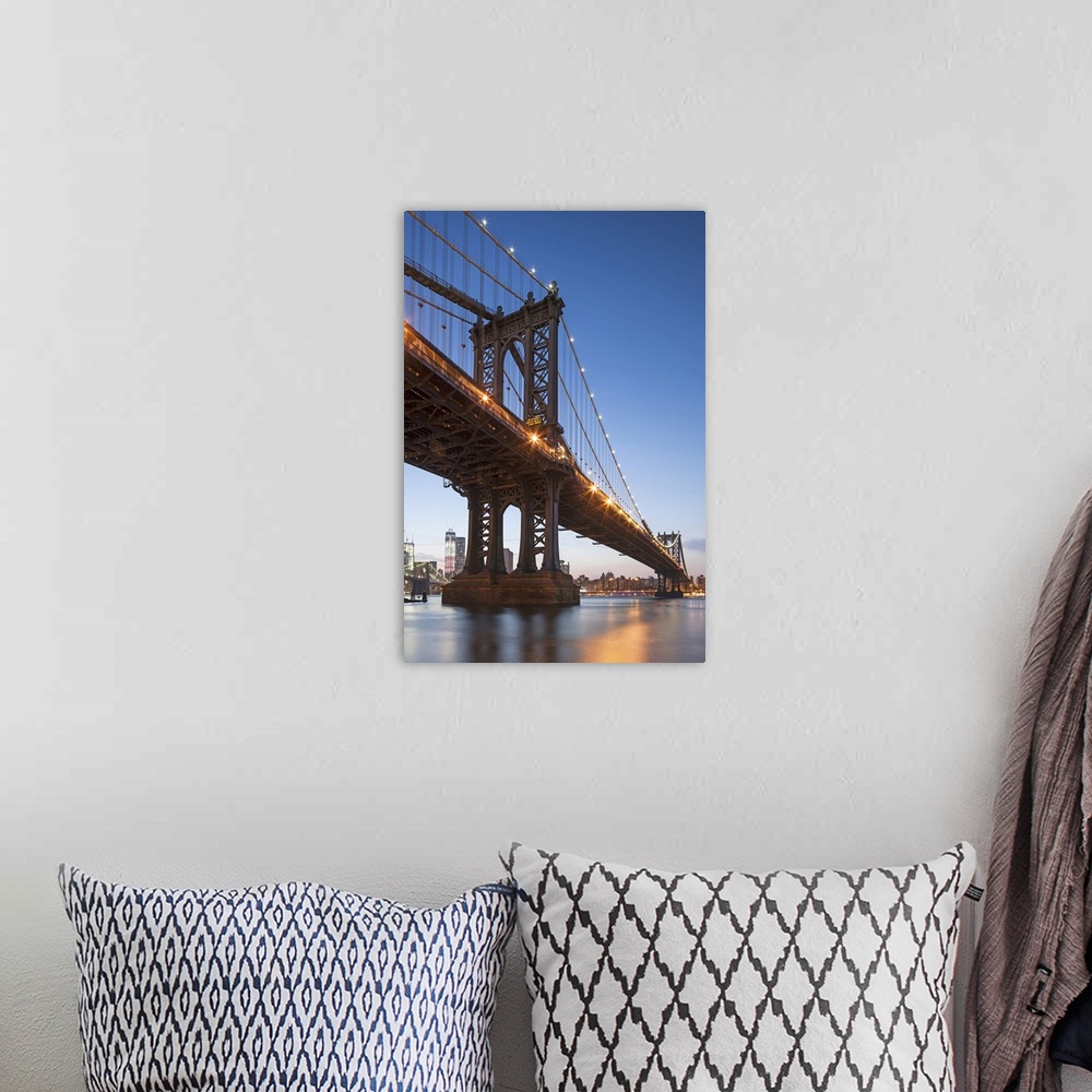 A bohemian room featuring Manhattan Bridge and Lower East Side at dusk in New York, New York State, USA