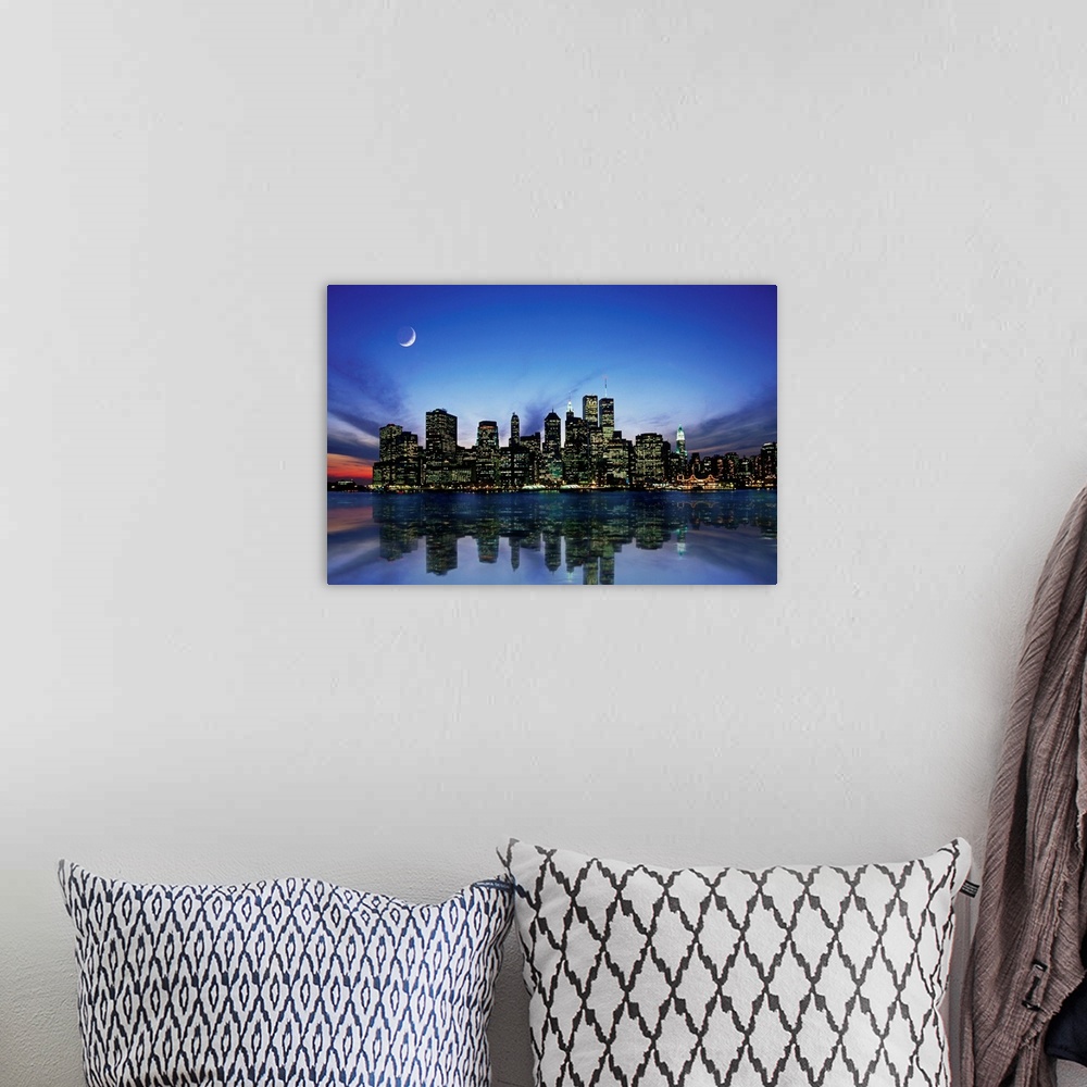 A bohemian room featuring Manhattan skyline at night, reflecting in river