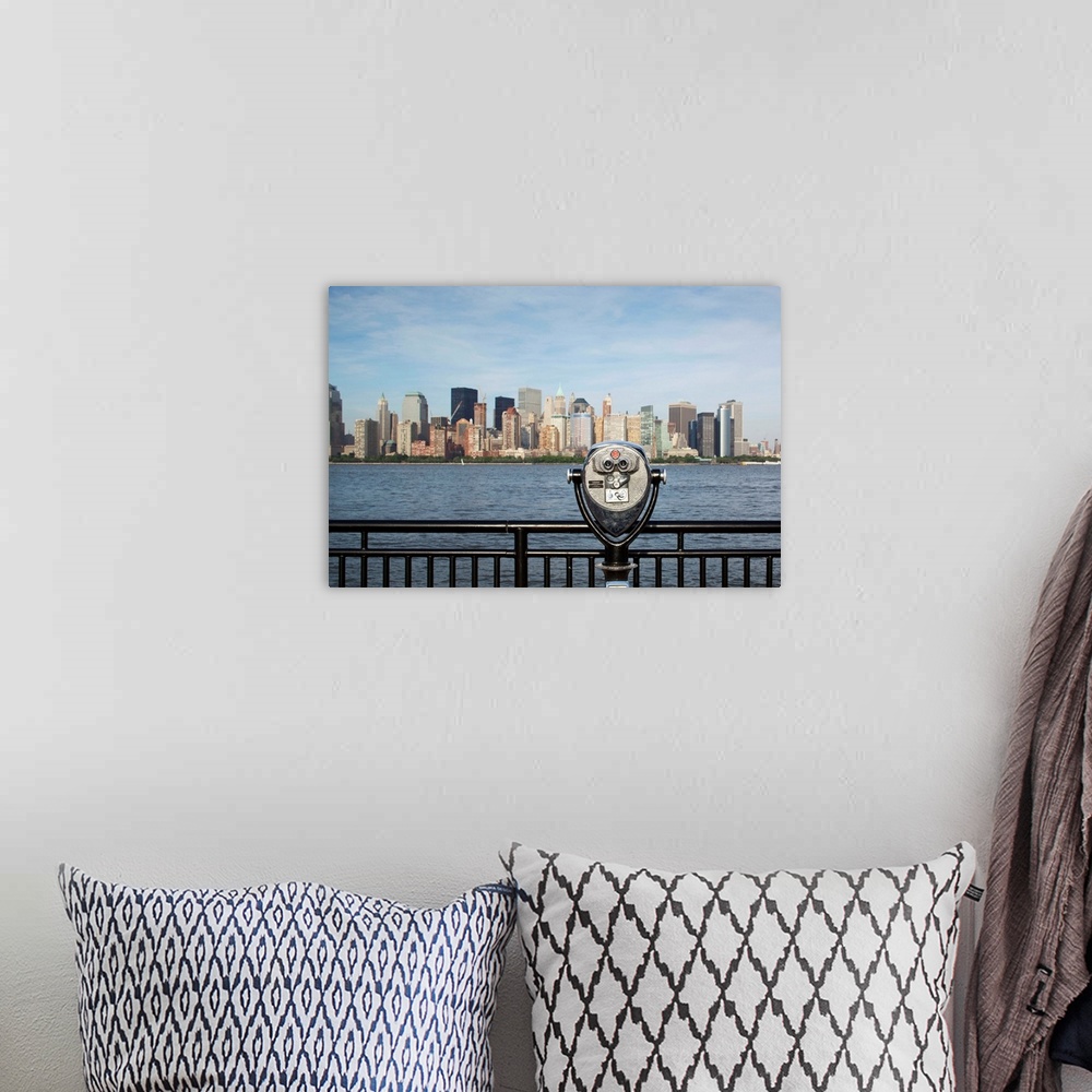 A bohemian room featuring USA, New Jersey, Jersey City, Coin operated binoculars pointed at Manhattan skyline rises from vi...