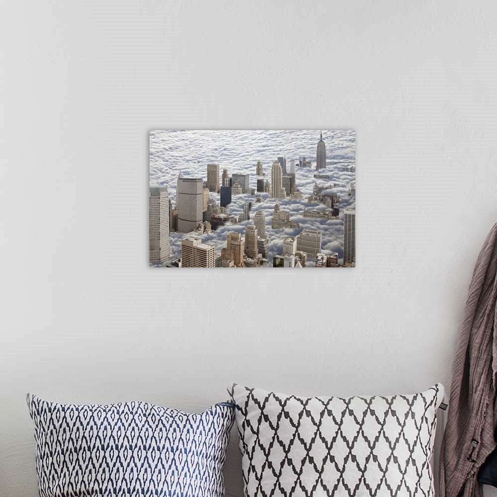 A bohemian room featuring Aerial photograph looking down on Manhattan, New York that is sitting in heavy fog and all you ca...