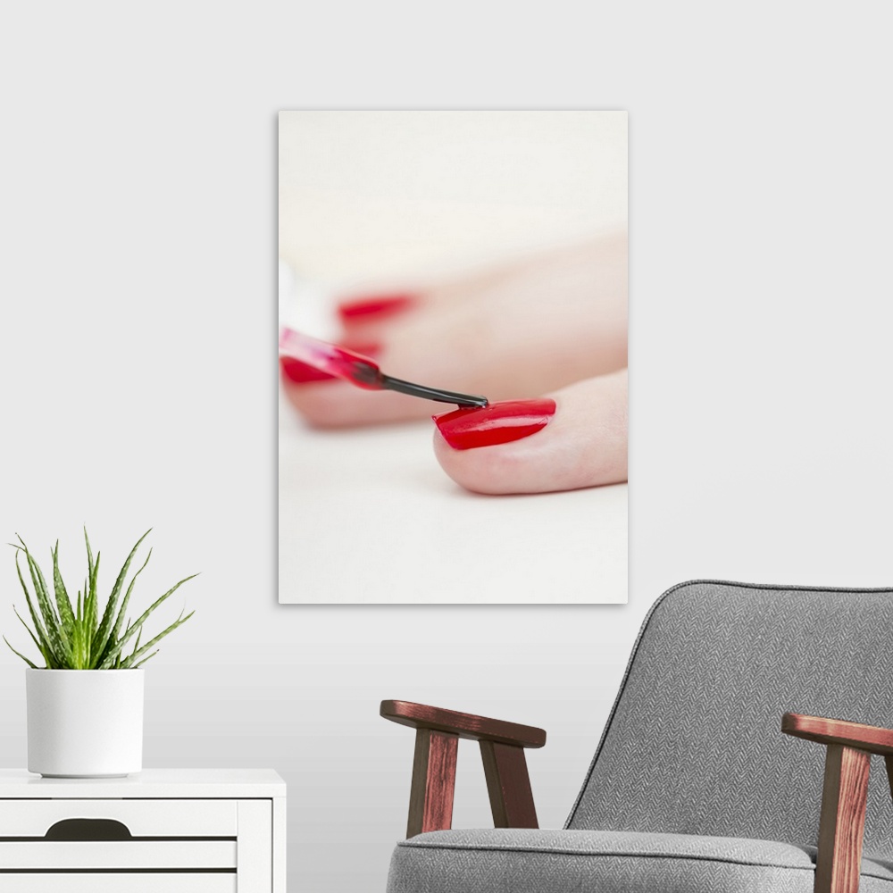 A modern room featuring Manicure with red nail polish