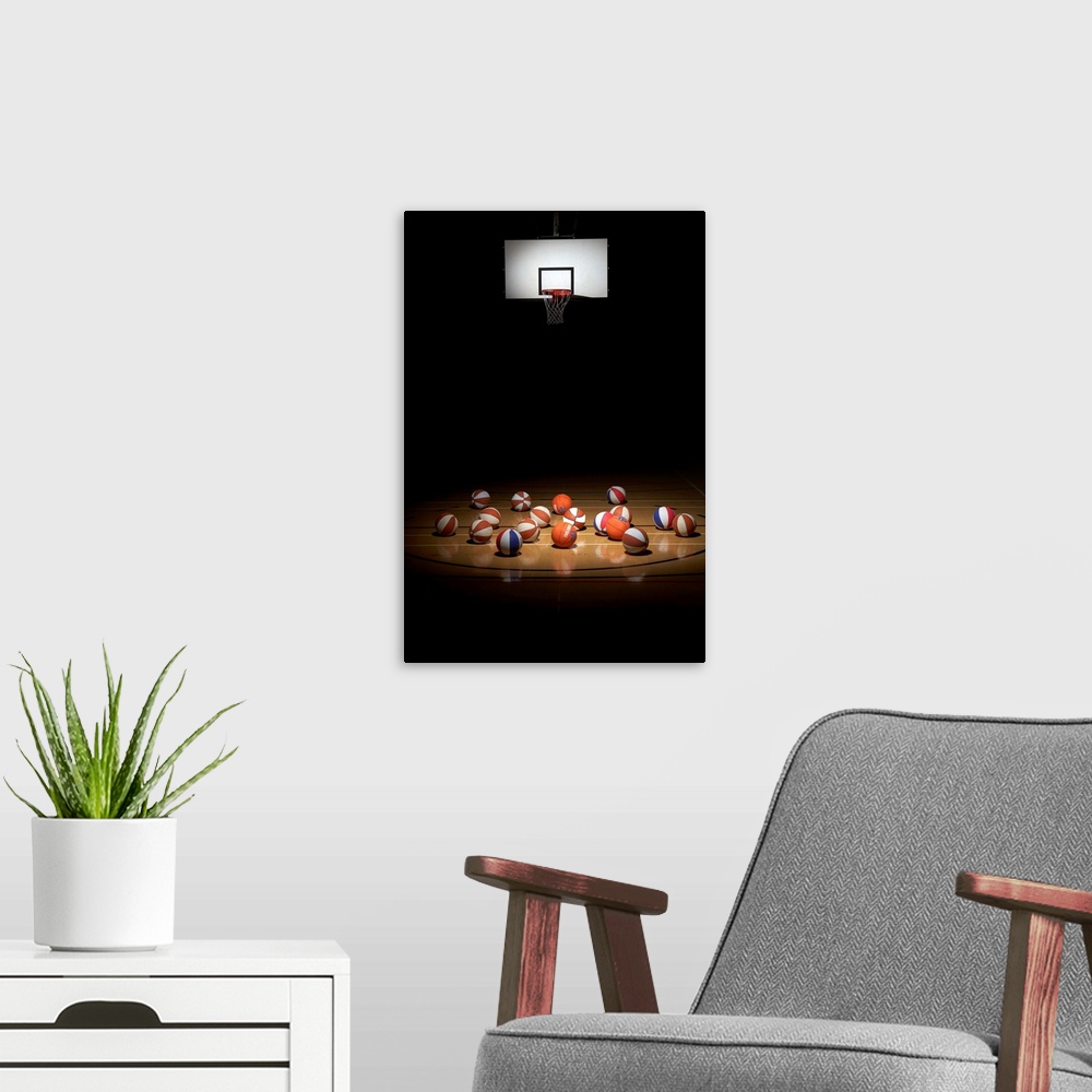 A modern room featuring Many basketballs resting on the floor