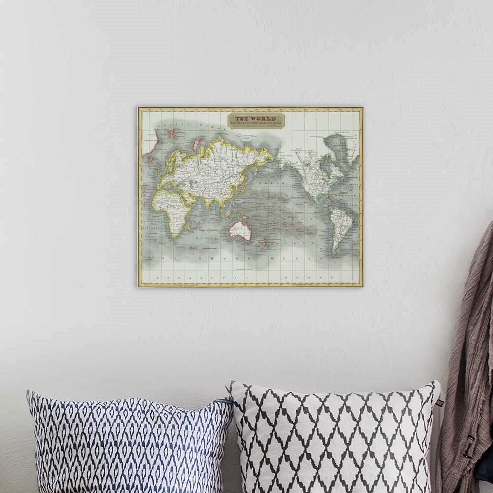 A bohemian room featuring Antique map of the world with the ocean levels reprensented by contrasting shades and rivers and ...