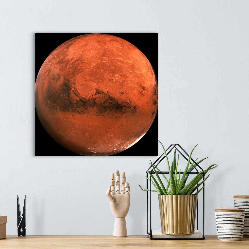 A bohemian room featuring Close-up color photograph of Mars. Impact craters are visible on the surface of the planet.