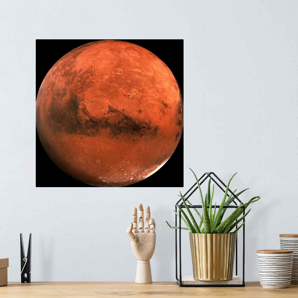 A bohemian room featuring Close-up color photograph of Mars. Impact craters are visible on the surface of the planet.