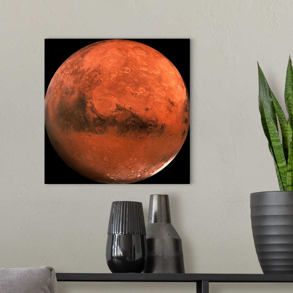 A modern room featuring Close-up color photograph of Mars. Impact craters are visible on the surface of the planet.