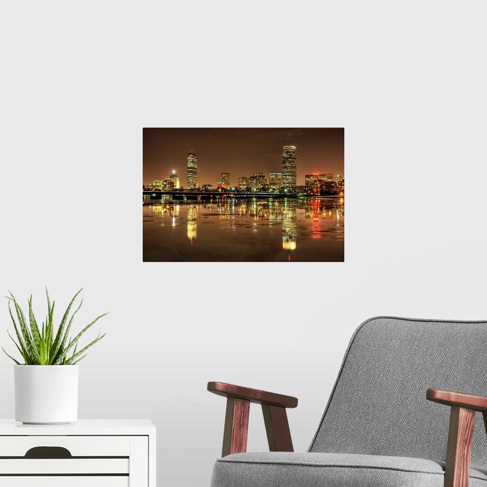 A modern room featuring Massachusetts Avenue Bridge and Boston skyline with reflection in Charles river at night in Cambr...