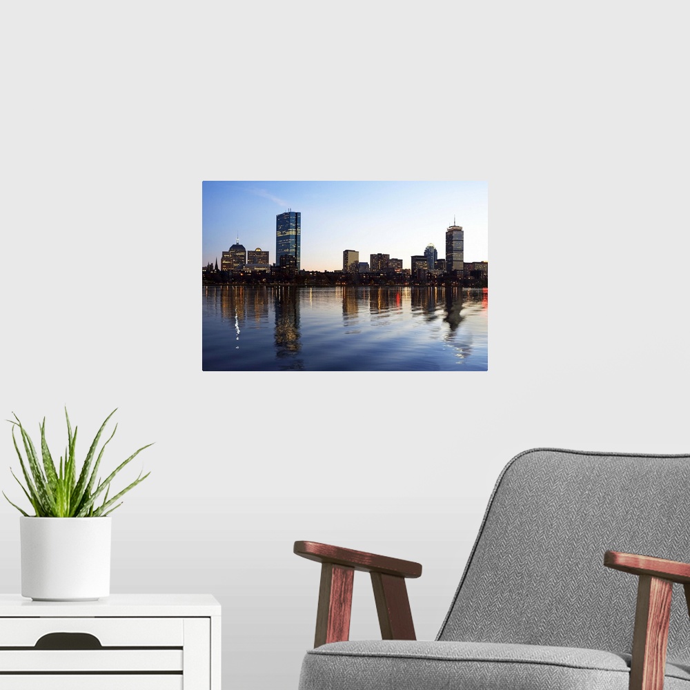 A modern room featuring USA, Massachusetts, Boston skyline at dusk