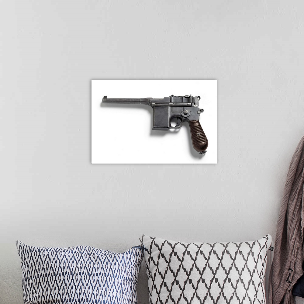 A bohemian room featuring C96 pistol, known as the Broomhandle.