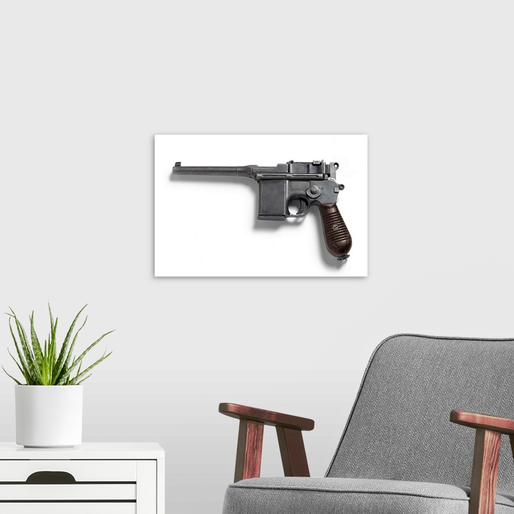 A modern room featuring C96 pistol, known as the Broomhandle.
