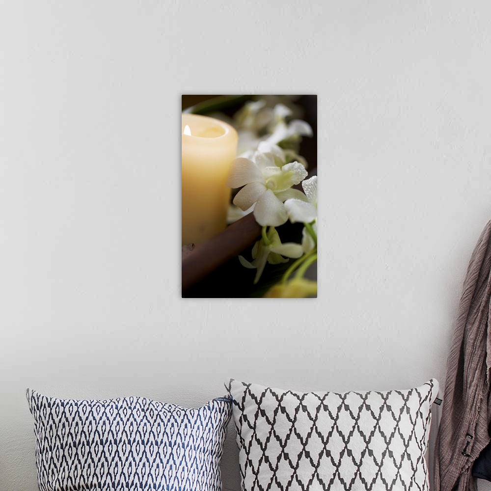A bohemian room featuring meditation candle in zen atmosphere and white orchids