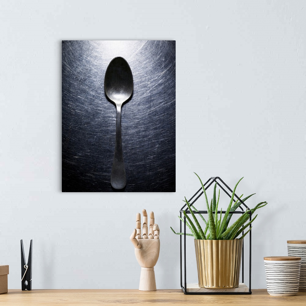 A bohemian room featuring Metal spoon on stainless steel.