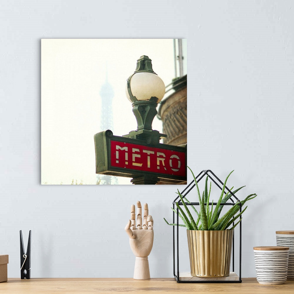 A bohemian room featuring Metro sing in Paris with Eiffel Tower background.