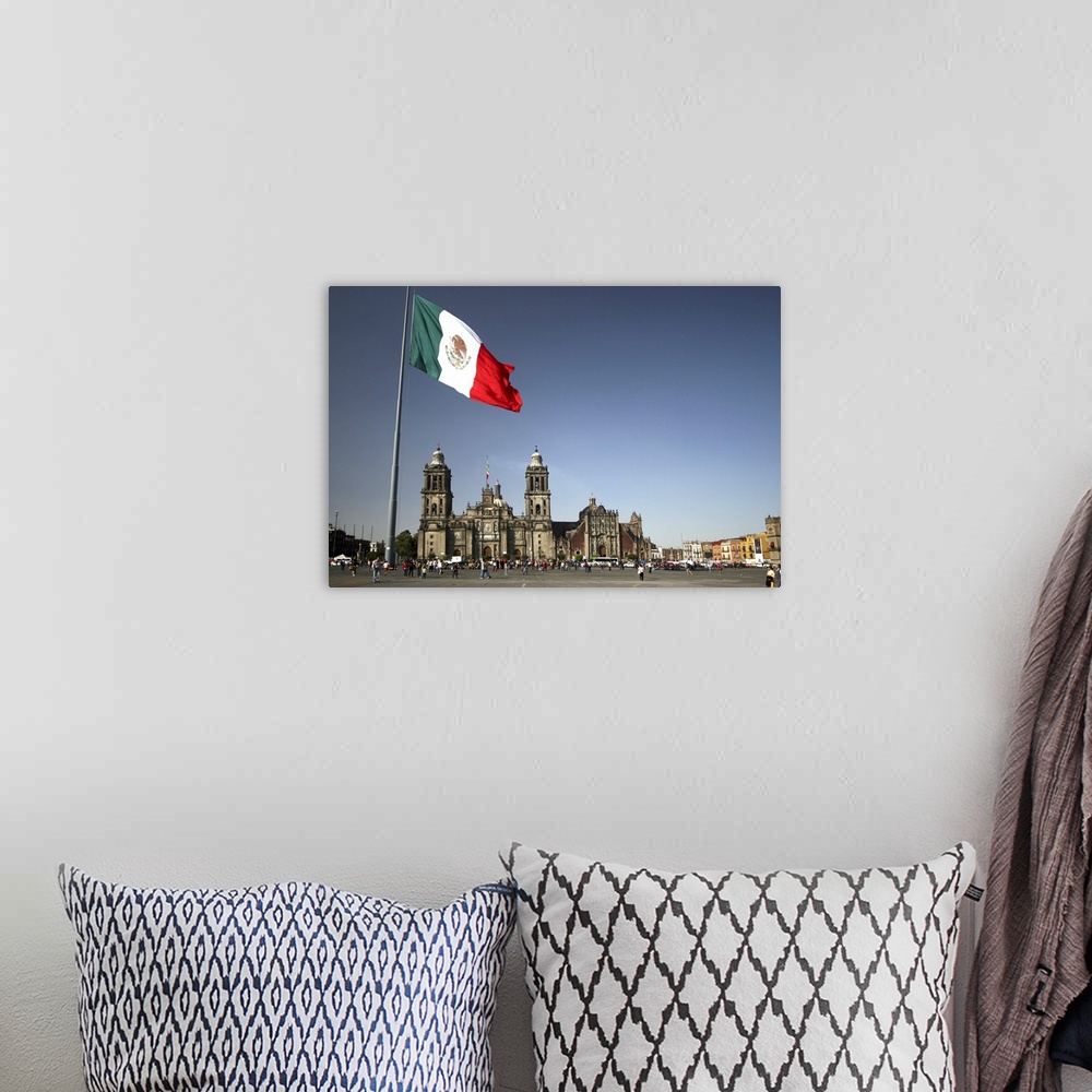 A bohemian room featuring Mexico City cathedral framed under the huge flag, at the Zocalo square, also called Plaza de la C...