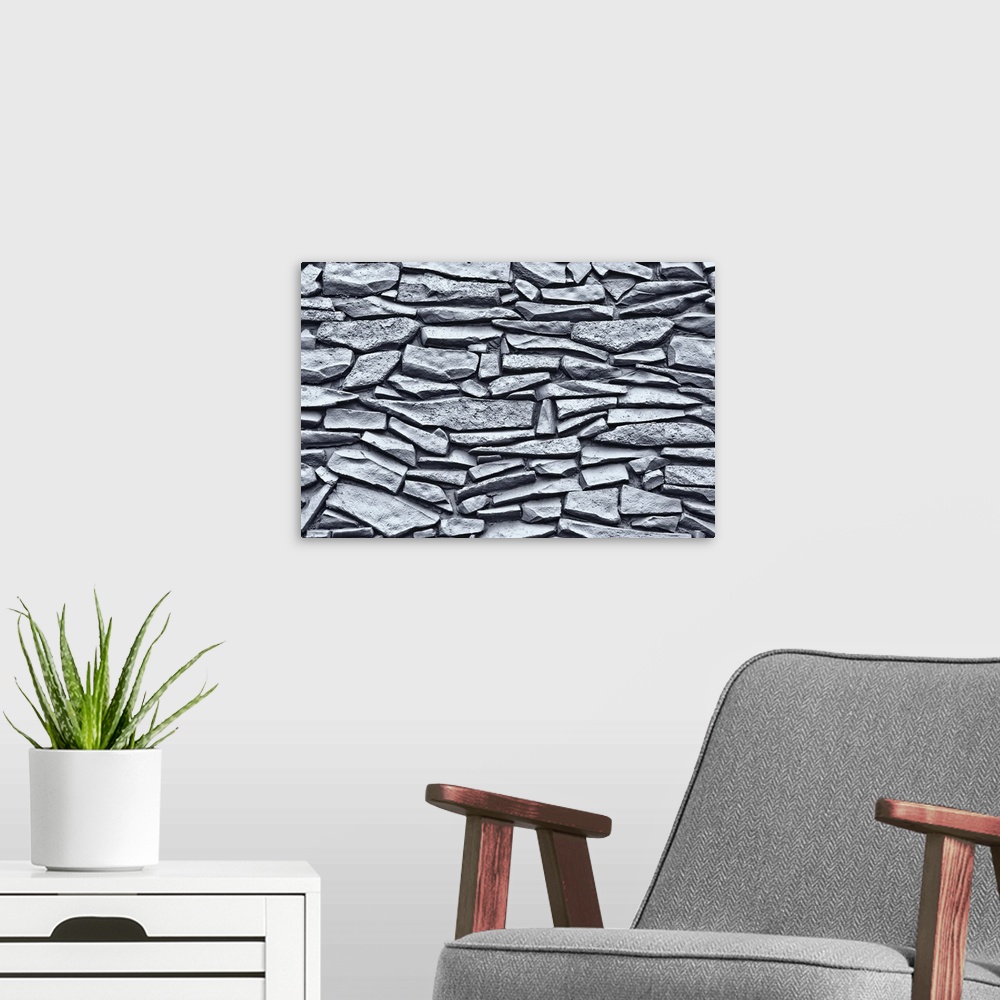 A modern room featuring Up close view of a Mexican rock wall printed on canvas.