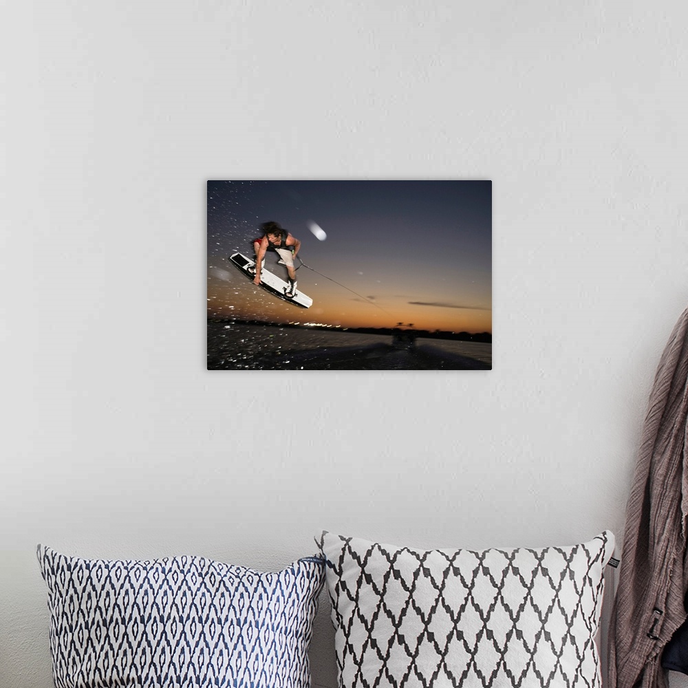 A bohemian room featuring Midair wakeboarder at sunset