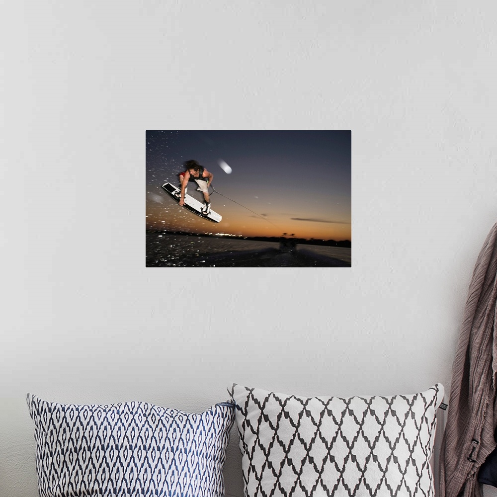 A bohemian room featuring Midair wakeboarder at sunset