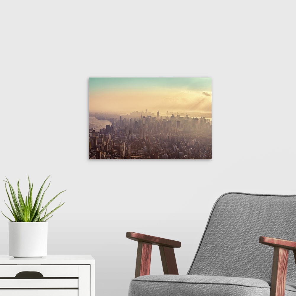A modern room featuring Midtown Manhattan at dusk with Jersey City and Brooklyn in background.