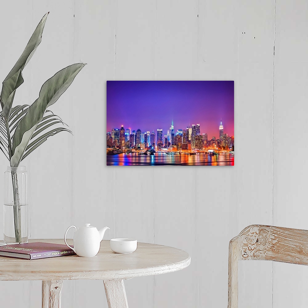 A farmhouse room featuring Photograph of New York skyline at night with the Hudson River in foreground.  The building lights...