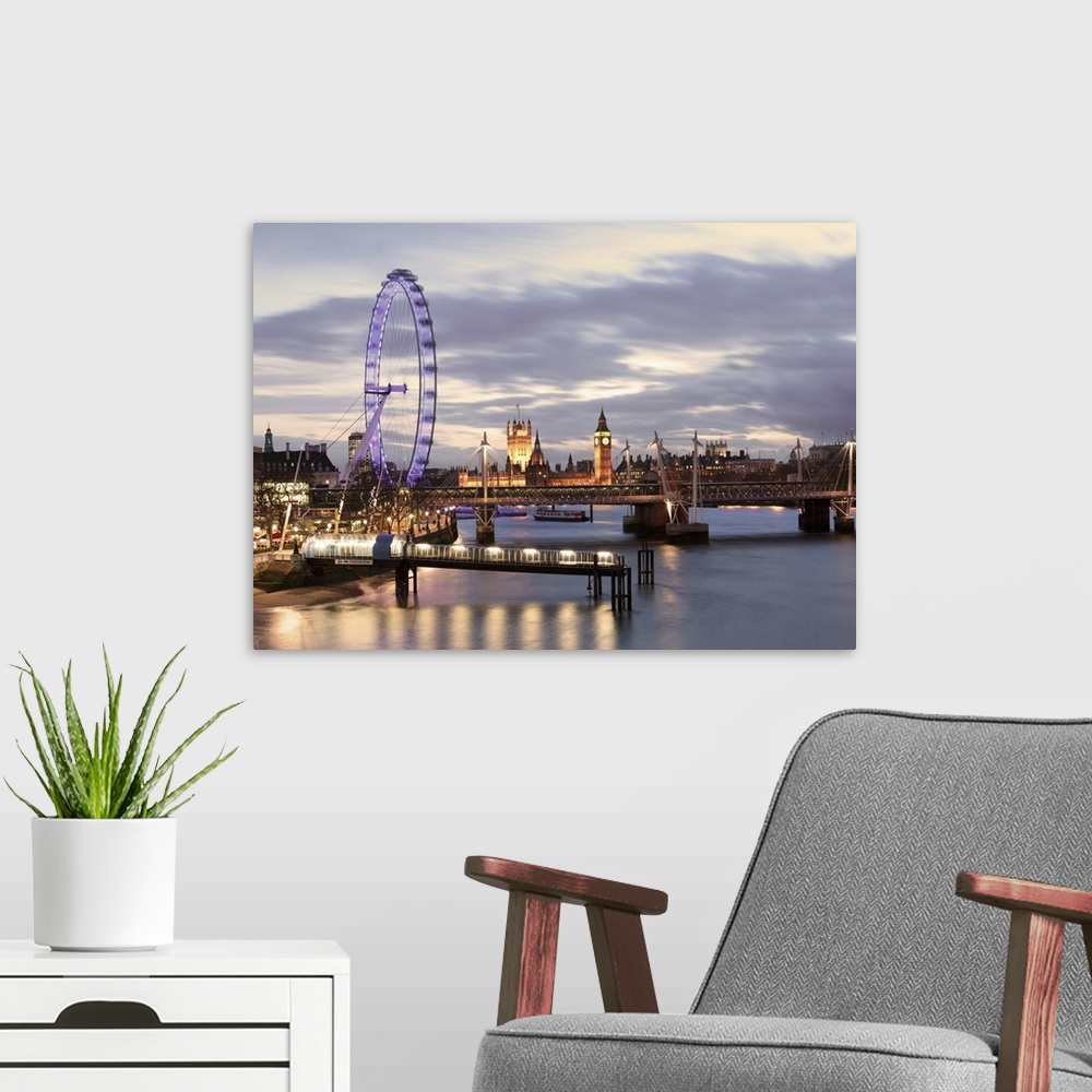 A modern room featuring Millenium Wheel, London Eye and Big Ben viewed over the river Thames